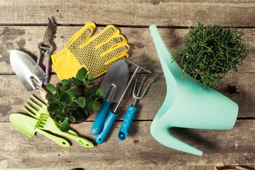 Gardeners team assessing a lawn with tools