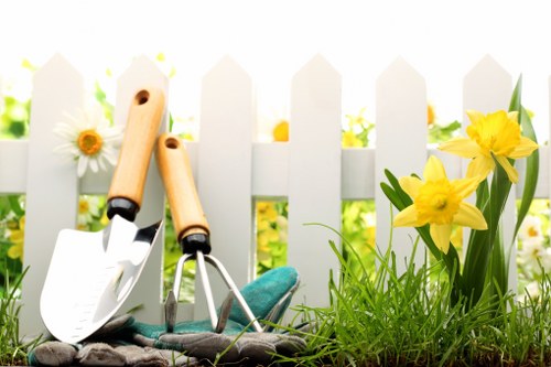Front view of a gardener inspecting a residential garden